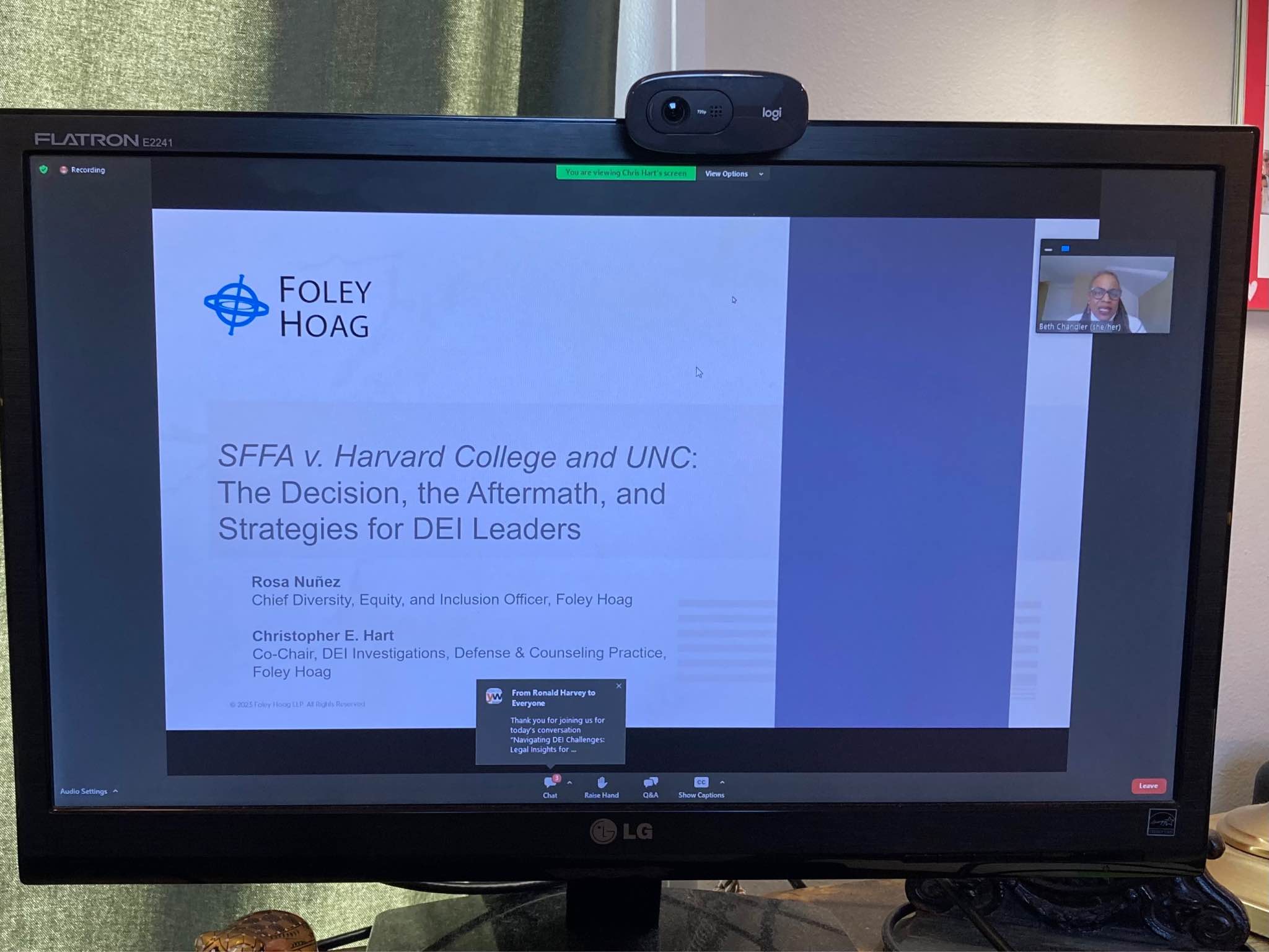 Photo of a computer screen showing a powerpoint slide. It's a cover slide showing the name of the law firm (Foley Hoag) and the presenters on the topic of "SFFA v. Harvard College and UNC: The Decision, the Aftermath, and Strategies for DEI Leaders."